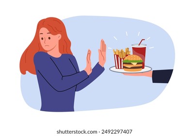 Refusal from fast food is demonstrated by woman who wants to go on diet and reduce amount of calories consumed. Girl turns away from tray with fast food in hands of interlocutor, demonstrating disgust