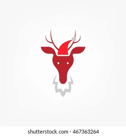 Reindeer child in Christmas red hat.