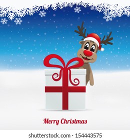 reindeer hat winter landscape behind gift box