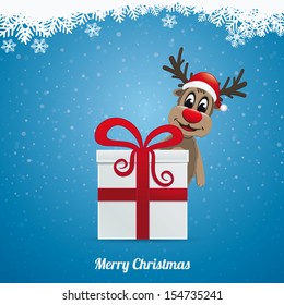 reindeer hat winter landscape behind gift box