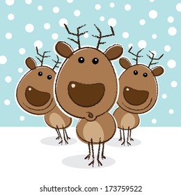 Reindeer in a herd with surprised look on face against a snowy background