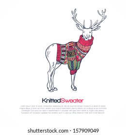 Reindeer in knitted sweater with ornament