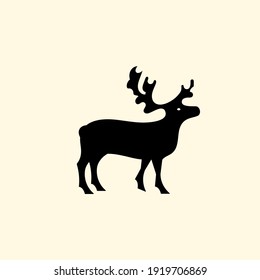 Reindeer logo with branched antlers. Logo. Emblem or symbol. Vector illustration. Flat design.