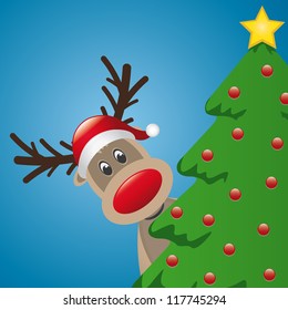 reindeer with santa hat behind christmas tree