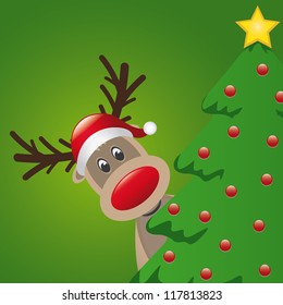 reindeer with santa hat behind christmas tree
