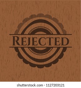 Rejected badge with wood background