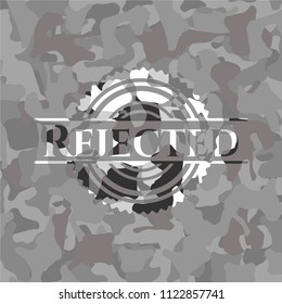 Rejected on grey camouflaged pattern