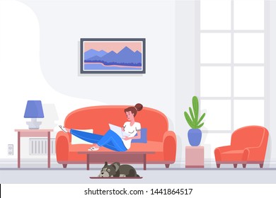 Relaxed female sitting on couch and browsing laptop while spending time at home.