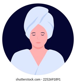 a relaxed woman in a bathrobe and with a towel on her head after taking a shower