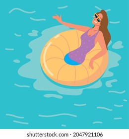 relaxed woman on floating ring in pool