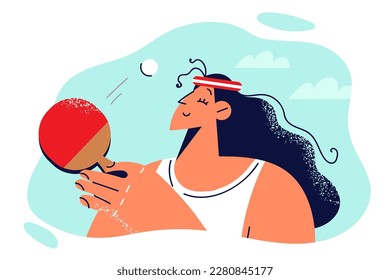 Relaxed woman playing table tennis with racket during match with opponent or training before game. Girl is professionally engaged in mini tennis or has hobby for relaxing in free time