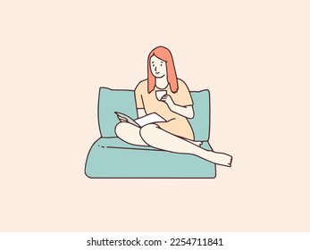 Relaxed woman reading with cup of tea sitting on beanbag simple korean style illustration