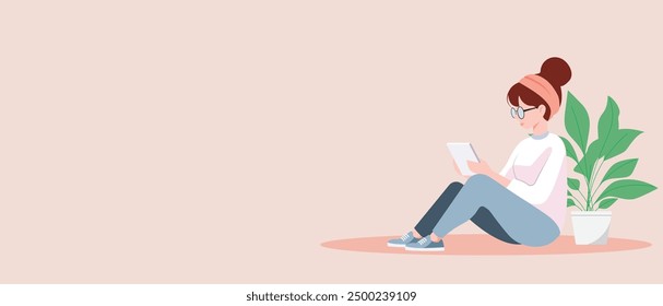 Relaxed woman sitting on the floor using a tablet