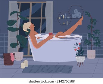 
Relaxed woman takes a bath at night by candlelight. mental health. Hygiene and beauty. The girl holds a glass of drink in her hands. Mindfulness, positive thinking, self care idea.