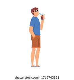 Relaxed Young Man Drinking Cocktail, Lounging Male Character Wearing Tshirt and Shorts Ready to Enjoy His Leisure Vacation, Summer Holidays and Traveling Cartoon Vector Illustration