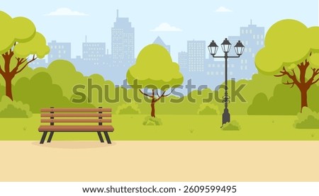 Relaxing park setting with green trees and city skyline in the background on a sunny day