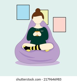 relaxing with tea in an armchair