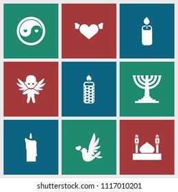 Religion icon. collection of 9 religion filled icons such as heart with wings, candle, menorah, mosque, love bird, yin yang. editable religion icons for web and mobile.