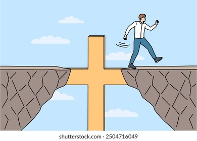 Religious business man overcomes obstacles thanks to christian crucifix and achieves goal. Guy corporate manager, is practicing catholic and achieves success in career using christian commandments.