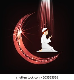 Religious muslim boy praying on glossy crescent moon background for Muslim community festival Eid Mubarak celebrations. 