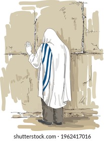 A religious orthodox jew in tallit prays at the sacred Western Wailing Wall.
