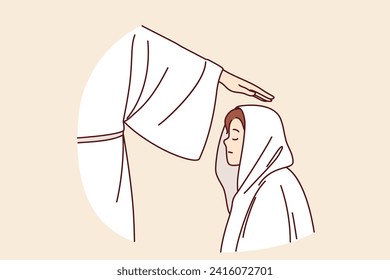 Religious ritual with initiation boy into brotherhood, and hand of apostle in white robe above child head. Religious ceremony with sect member during pronunciation of oath or baptism of teenage kid