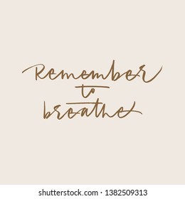 Remember to breathe calligraphic phrase on pale pink background