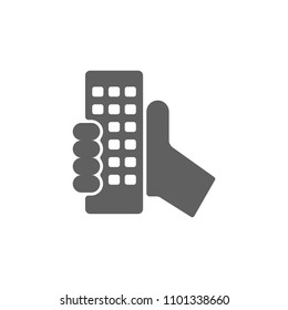 Remote control in hand icon vector in trendy flat style isolated on white background