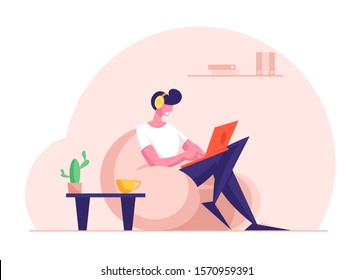 Remote Freelance Work Concept. Man Freelancer Wearing Headset Sitting in Comfortable Armchair Working Distant on Laptop. Creative Employee Character Work at Home. Cartoon Flat Vector Illustration