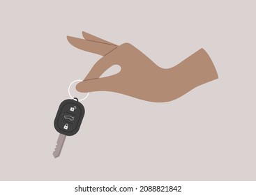 A rental service, a  hand holding a remote control vehicle key, a car-sharing concept