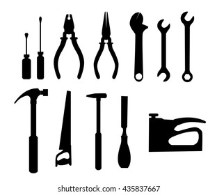 Repair and construction working tools for carpentry and home renovation hanging on a pegboard