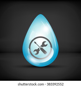 Repair icon in a water drop on a black background