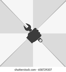 Repair service hand holding a wrench.