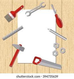 repair tools on  white sheet of paper on wooden background