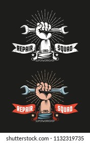 Repair workshop logo in vintage style. The hand holds  wrench. Heraldic ribbon with inscriptions. Black background. Color and monochrome versions. Grunge worn texture on separate layer.