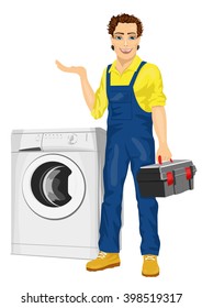 Repairman holding a toolbox and posing next to a washing machine showing something