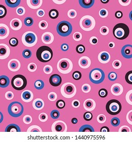 Repeat pattern in half drop. Dots in circles in different shapes and form. In a limited color palette of black, blue and pink. Bright neon like colors. Light and bright pink. Eyes or use imagination.