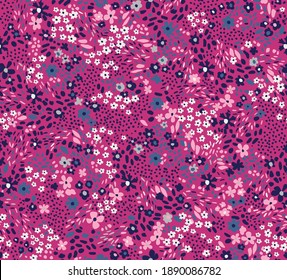 Repeatable floral pattern consisting of colorful mini flowers on pink background.