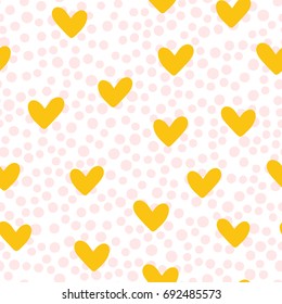 Repeated cute hearts. Polka dot. Seamless pattern. Drawn by hand. White, pink, yellow color. Vector illustration.