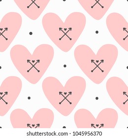 Repeated hearts with crossed arrows and round dots. Cute seamless pattern. Stylish girly print. Drawn by hand. Endless romantic vector illustration.