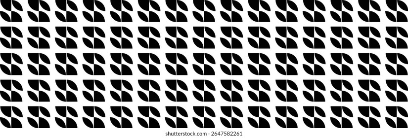 A repeating geometric pattern of black and white shapes resembling leaves .