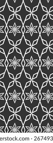 A repeating geometric pattern featuring hexagonal shapes and floral designs in white on a dark background.