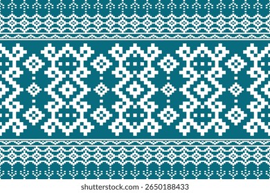A repeating geometric pattern in white on a teal blue background Features intricate snowflake and diamond motifs reminiscent of cross stitch or embroidery