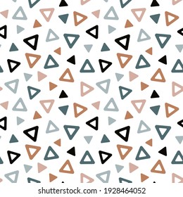 Repeating multicolored triangles confetti seamless pattern. Abstract geometric background with triangles of different sizes in brown, black, blue, pink, pastel colors. 