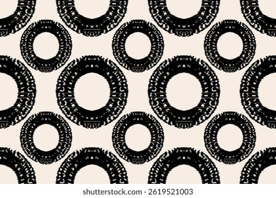 Um padrão repetitivo de círculos pretos com desenhos decorativos intrincados em um fundo de cor creme. Etnia Ikat abstrato arte de fundo. Ilustração para moda, tecido, têxtil, papel de parede