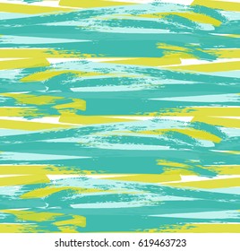 Repeating pattern with Green and orange paint texture.Hand drawn with rough paint seamless background. Colorful brushed backdrop with some grunge texture and overlapping strokes.