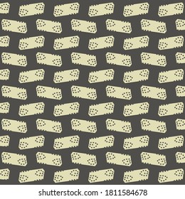 Repeating pattern made of parallelogram patches marked with some dots and with two opposite corners cut. Textile design in black and white.