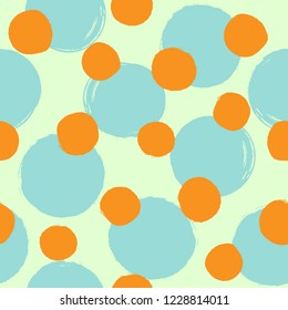 Repeating round dots drawn by hand with rough brush. Creative seamless pattern for children. Grunge, watercolor, sketch, paint. Simple vector illustration.