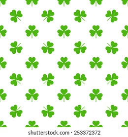 Repeating vector green clovers pattern 