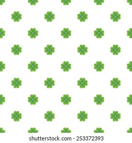 Repeating vector green clovers pattern 